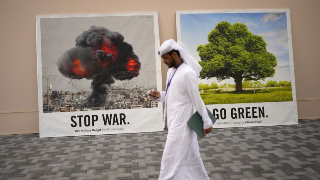 A person walks past signs that read