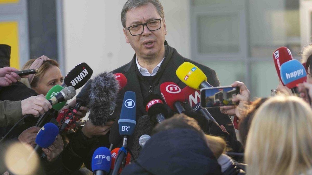 Serbian President Aleksandar Vucic speaks to the media after casting his ballot for a parliamentary and local election at a polling station in Belgrade, Serbia