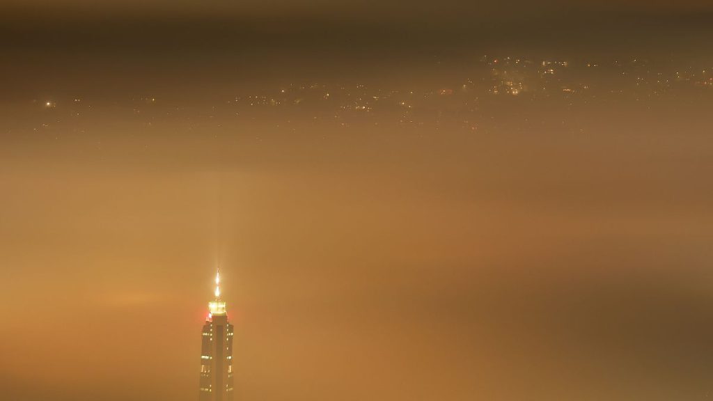 The Avaz Twist Tower building rises above as smog covers Sarajevo, Bosnia, 19 Dec 2023