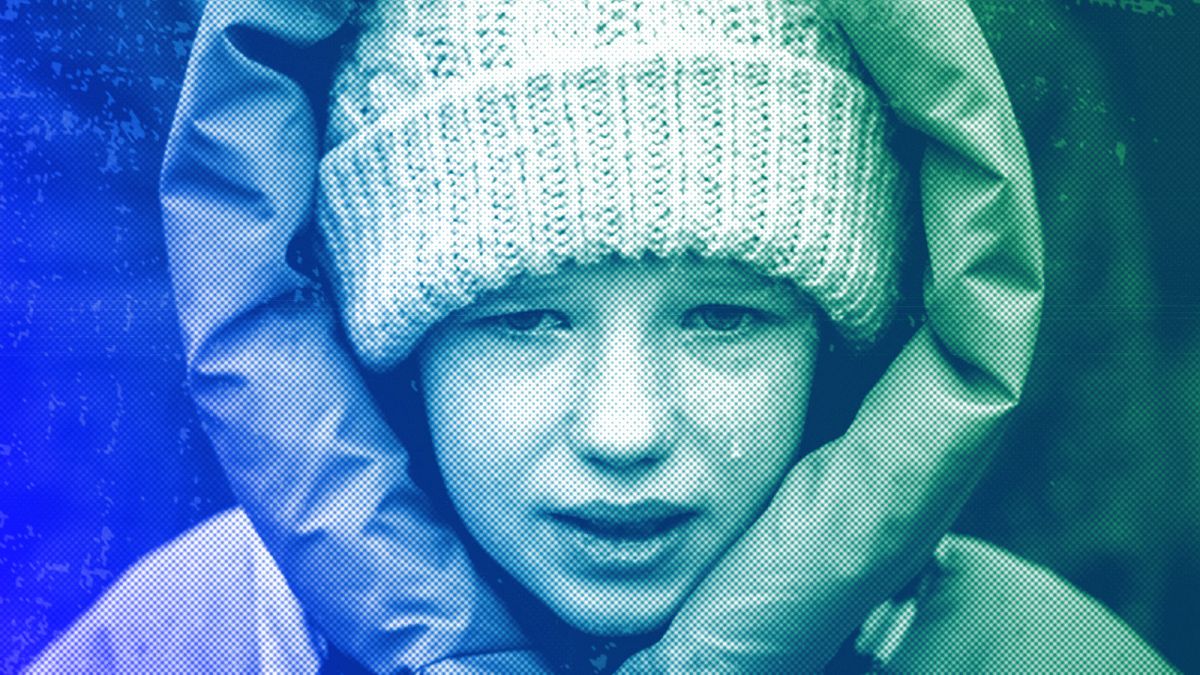 Anna, 10, cries next to the body of her brother Yurii, 27, during his funeral in Kalynivka, near Kyiv, February 2023