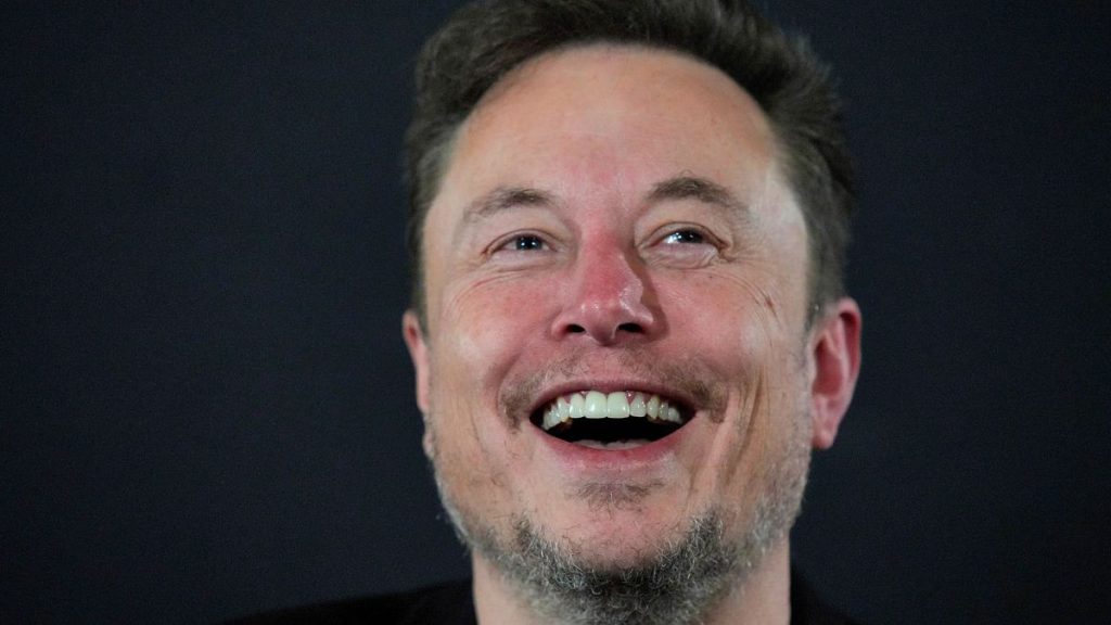 X (formerly Twitter) CEO Elon Musk laughs during an in-conversation event with Britain