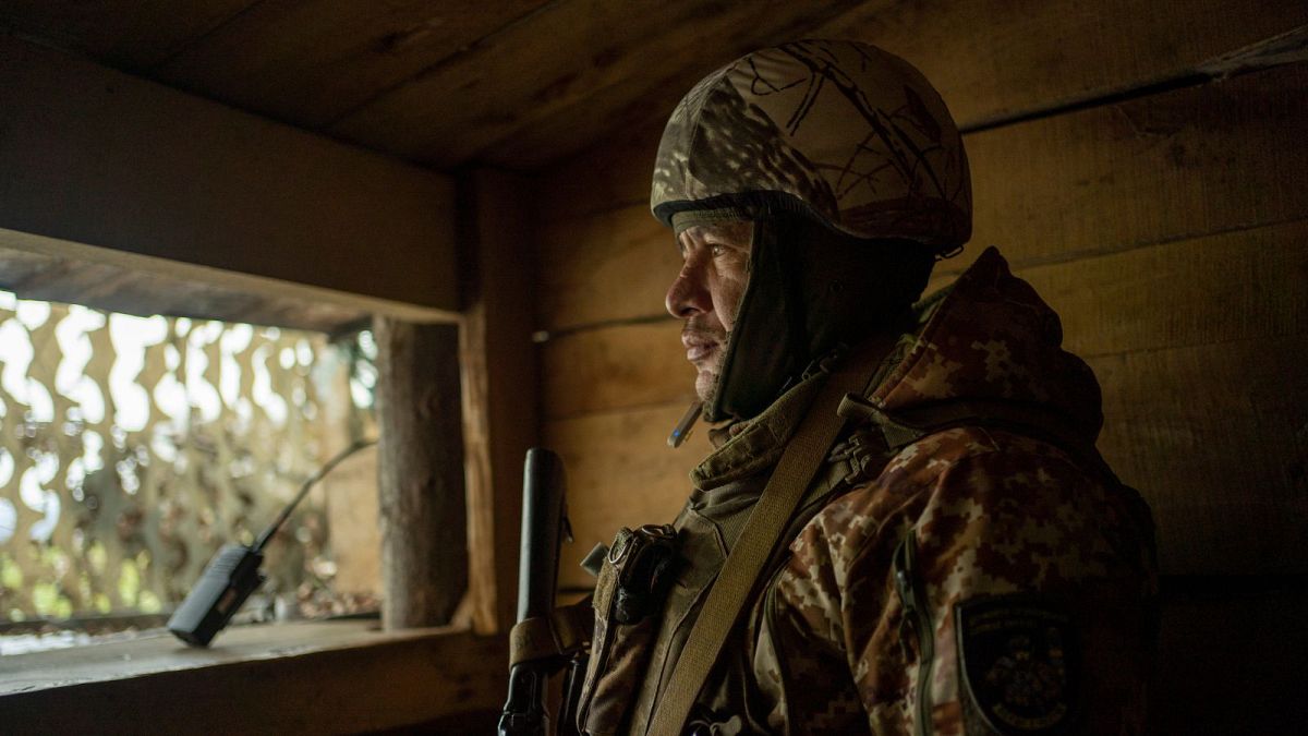 Ivan Kravchenko, a soldier of the state border guard, stands watch at a post where Ukrainian troops monitor Russian positions in the Sumy region, Ukraine, on Nov. 24.