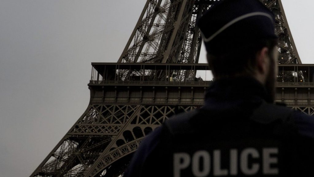 A French policeman patrols near the Eiffel Tower, in Paris earlier in December