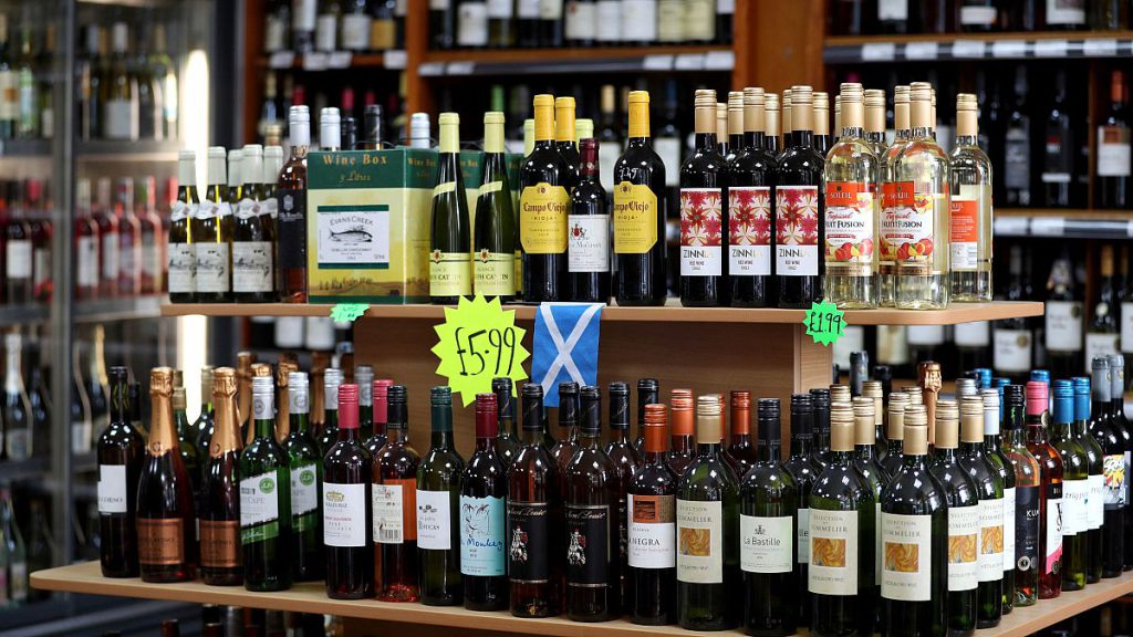 Shelves of alcoholic drinks are displayed for sale in an Edinburgh off-licence.