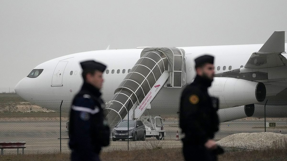 PhotoGendarmes patrol by the plane grounded by police based that it could be carrying trafficking victims, at the Vary airport