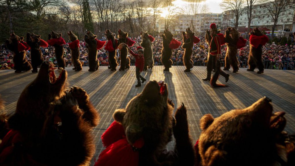 Members of a regional bear pack perform during a festival in Moinesti, northern Romania, Wednesday, Dec. 27, 2023.