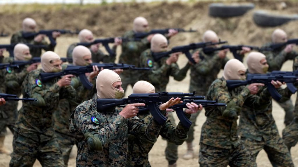 Fighters from the Lebanese militant group Hezbollah carry out a training exercise in Aaramta village in the Jezzine District, southern Lebanon in May 2023