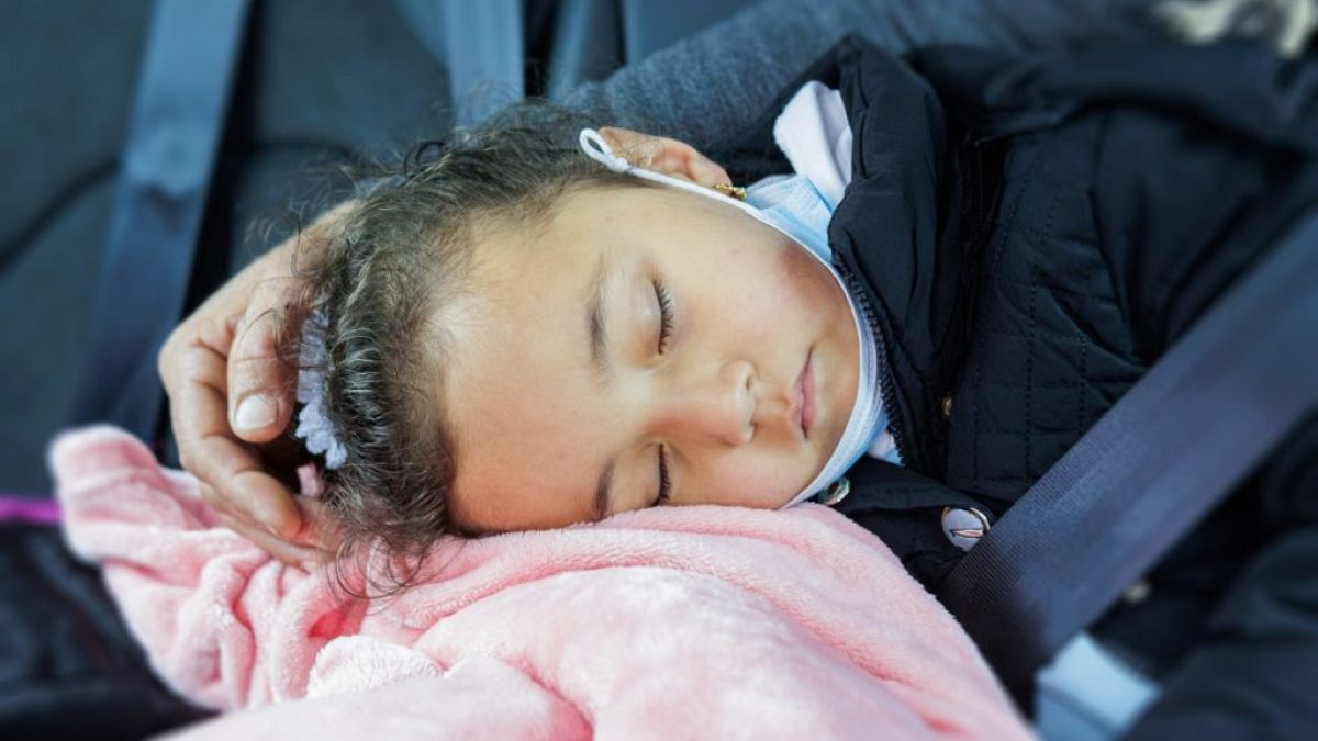 A young Palestinian is driven to a medical appointment in Israel