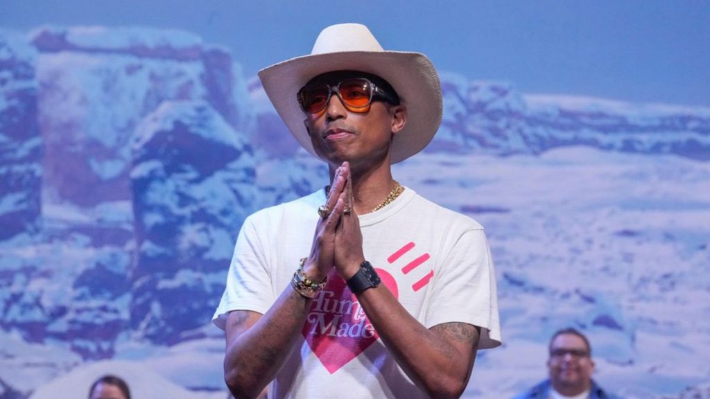 Pharrell Williams accepts applause after the Louis Vuitton Menswear ready-to-wear Fall-Winter 2024-2025 collection presented in Paris, Tuesday, Jan. 16, 2024.