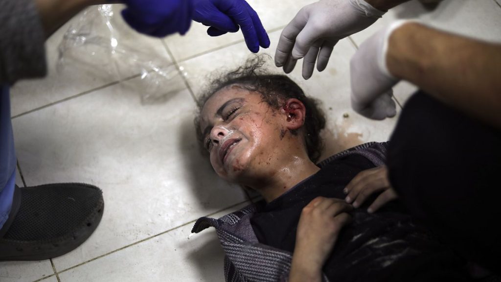 A Palestinian child wounded during the Israeli bombardment of the Gaza Strip receives treatment at the Nasser hospital in Khan Younis, Southern Gaza Strip, Saturday, Jan. 6