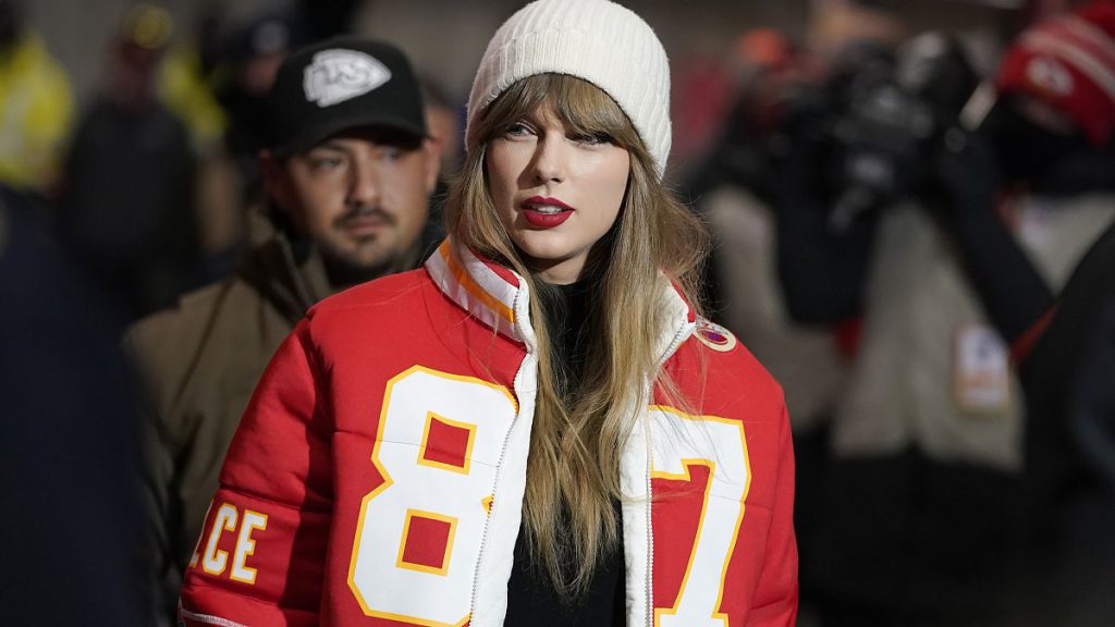 Pornographic deepfakes of Taylor Swift spark calls for new AI legislation - pictured here at NFL playoff between Chiefs and Dolphins