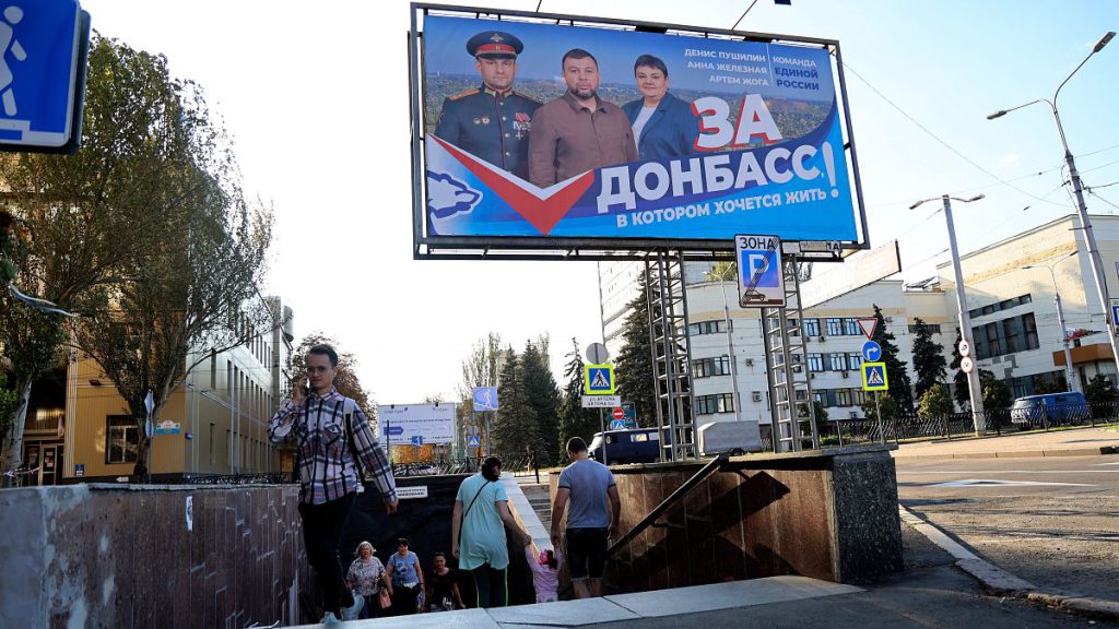 A United Russia party poster reads: