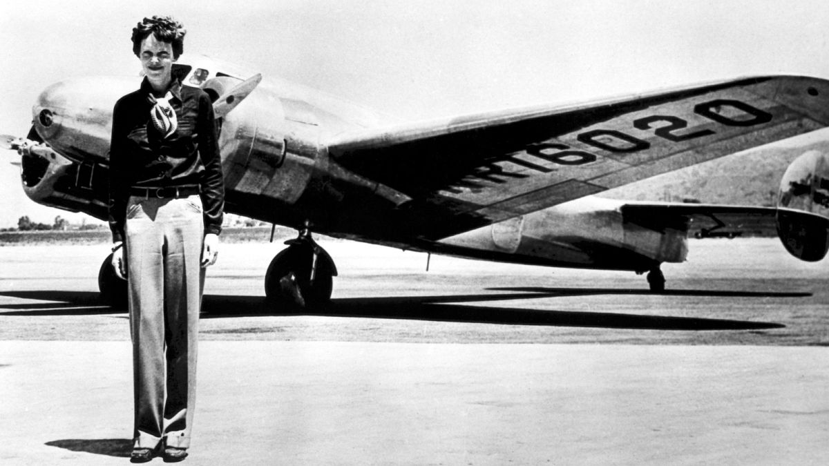 Amelia Earhart with her iconic Lockheed Electric aircraft in which she disappeared attempting to circumnavigate the globe in July 1937.