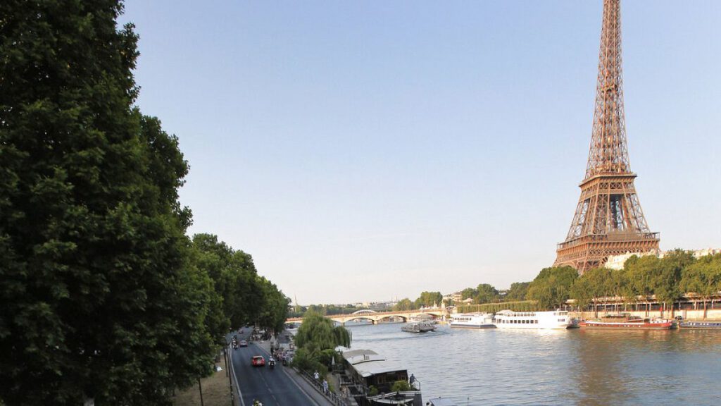 In this July 21, 2013 file photo shows the road along the Seine river, with the Eiffel Tower at right, in Paris.