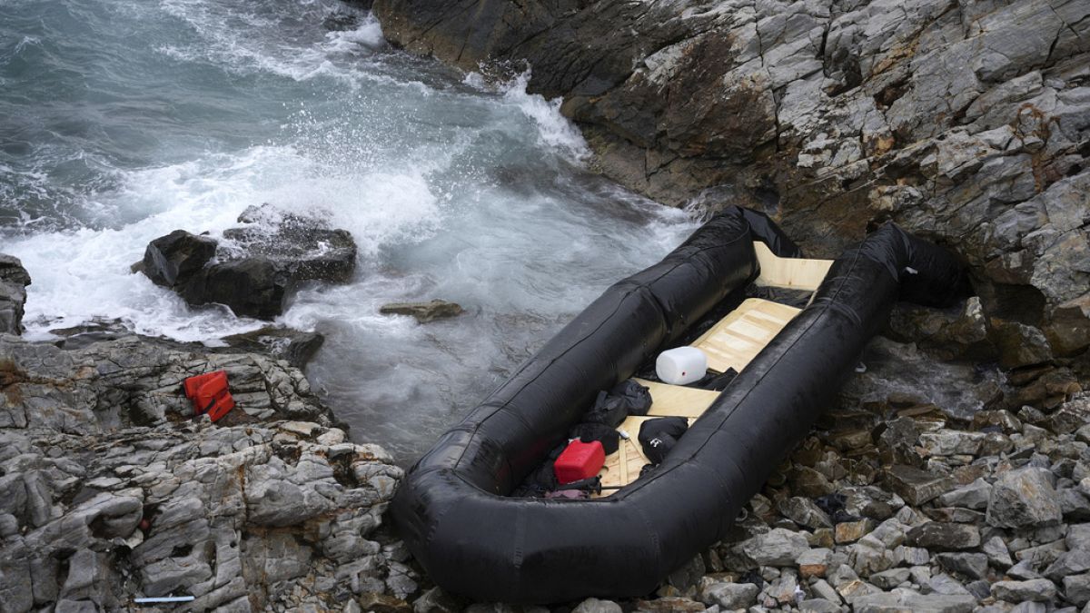 A dinghy lies on the shore after a shipwreck in Thermi, on the northeastern Aegean Sea island of Lesbos, Greece which killed two migrants