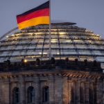 The German national flag waves on top of the Reichtstag building in Berlin, Germany, Thursday, Aug. 31, 2023. The Reichstag is the home of the German parliament Bundestag. (AP