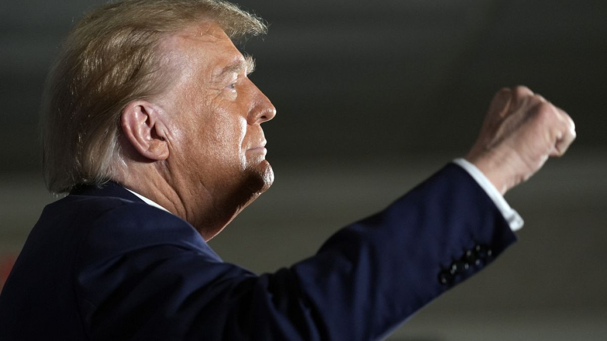 Republican presidential candidate former President Donald Trump gestures as he arrives at a campaign event in Laconia, N.H., Monday, Jan. 22, 2024.