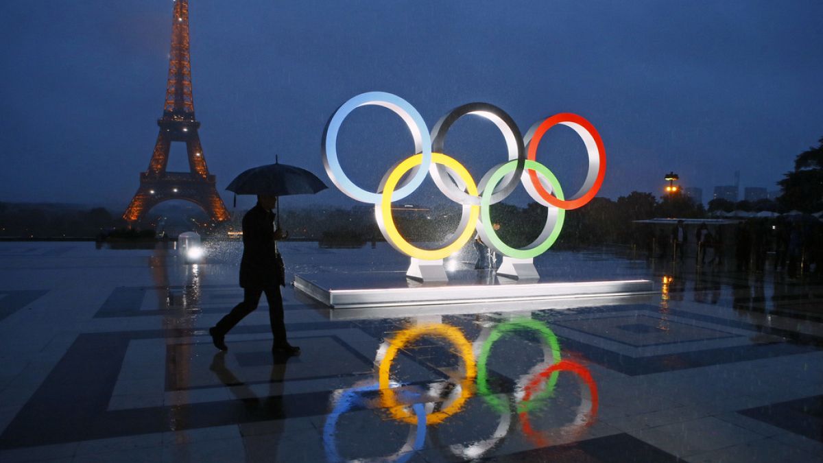 A display of the Olympic rings is set up on Trocadero plaza that overlooks the Eiffel Tower