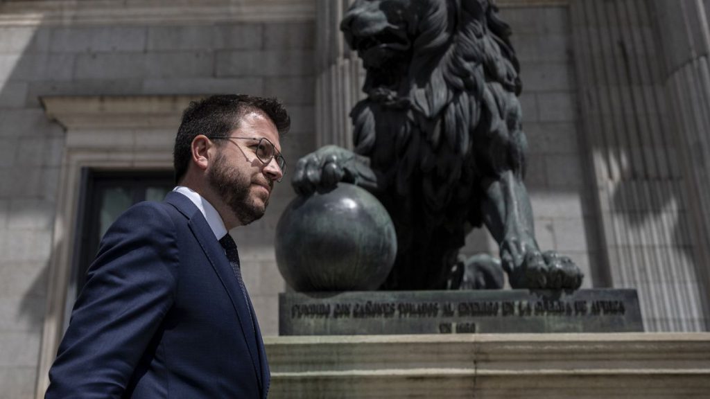 Catalan President Pere Aragones walks in front of the Spanish Parliament in Madrid, Spain, on April 21, 2022.