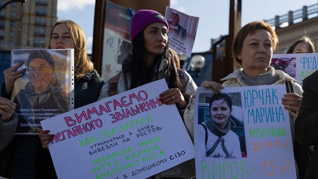 People hold the posters