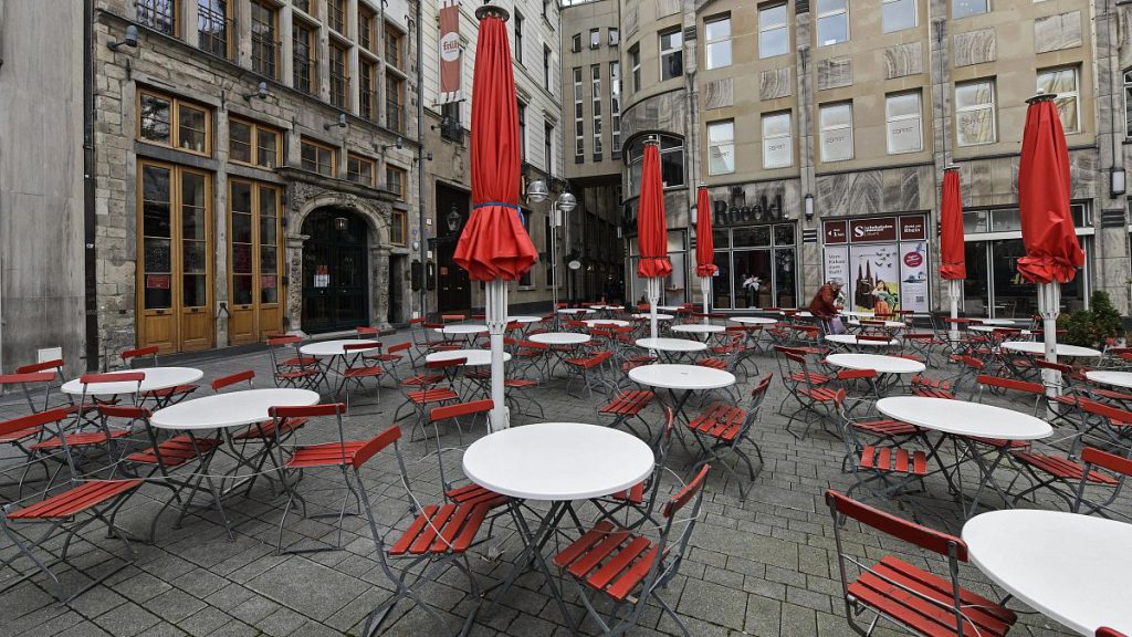 Empty tables in a deserted square in Cologne, Germany. March 18, 2021.