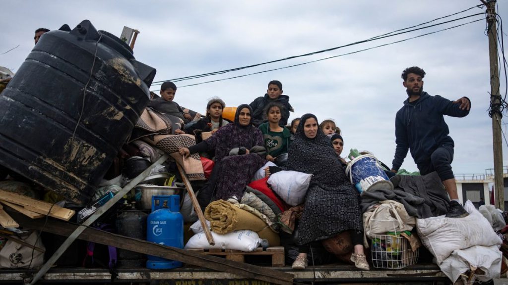 Palestinians arrive in the southern Gaza town of Rafah after fleeing an Israeli ground and air offensive in the nearby city of Khan Younis on Friday, Jan. 26, 2024.