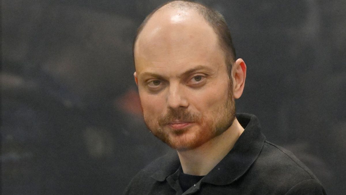 Russian opposition activist Vladimir Kara-Murza stands in a glass cage in a courtroom at the Moscow City Court in Moscow, Russia, Monday, July 31, 2023.