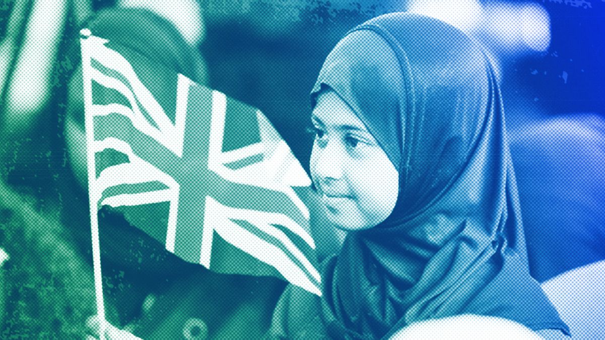 A girl waves a flag of the United Kingdom during a national Muslim memorial for the late Queen Elizabeth II at the central mosque in London, September 2022