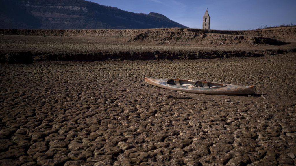 An abandoned canoe lies on the cracked ground at the Sau reservoir, which is only at 5 percent of its capacity, in Vilanova de Sau, about 100 km north of Barcelona
