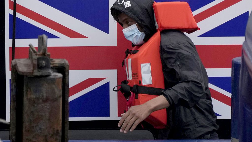 FILE - A man thought to be a migrant disembarks after being picked up in the Channel by a British border force vessel in Dover, south east England, 13 August, 2021.