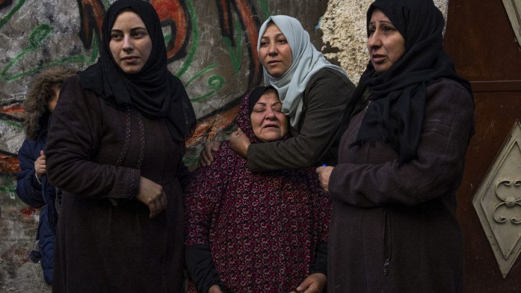 Palestinian women react after their home was hit by an Israeli strike in Rafah, southern Gaza Strip, Thursday, Feb. 8, 2024.