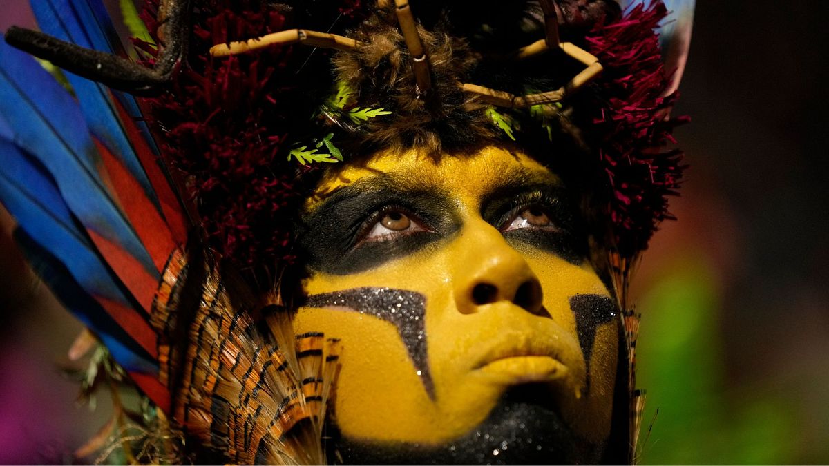 A performer from the Salgueiro samba school parades during Carnival celebrations at the Sambadrome in Rio de Janeiro, Brazil, 12 February 2024.