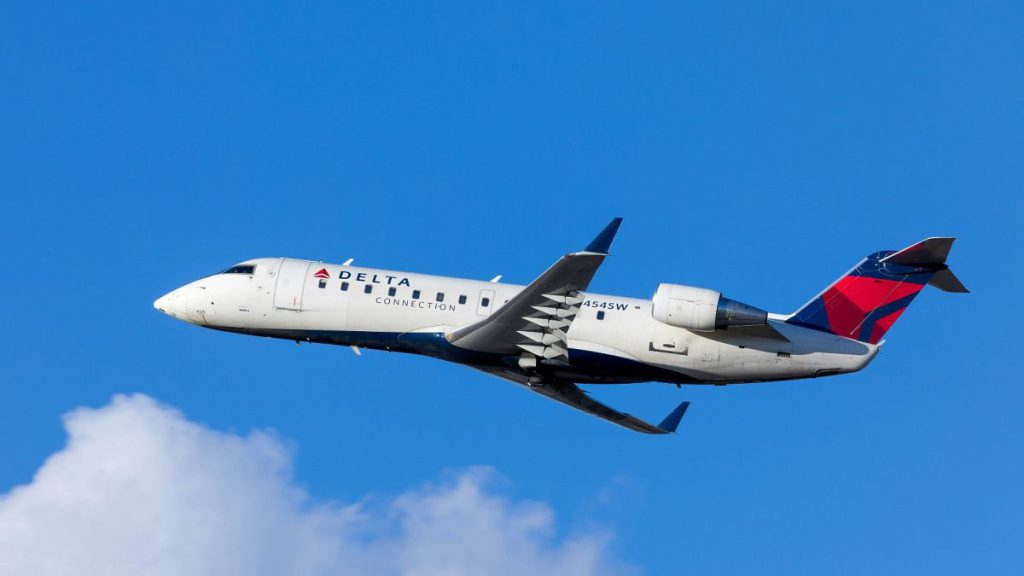 A Delta plane flies through the air