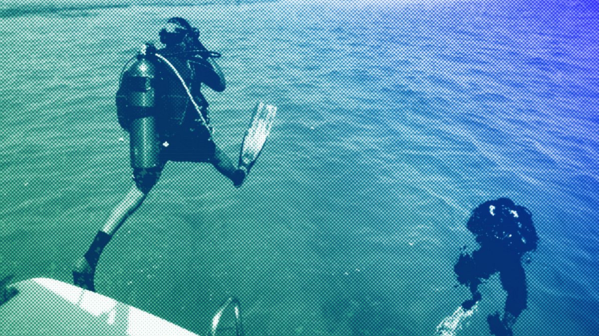 Two diving instructors explore the waters off a sandy island in the Red Sea near King Abdullah Economic City, Saudi Arabia, March 2018