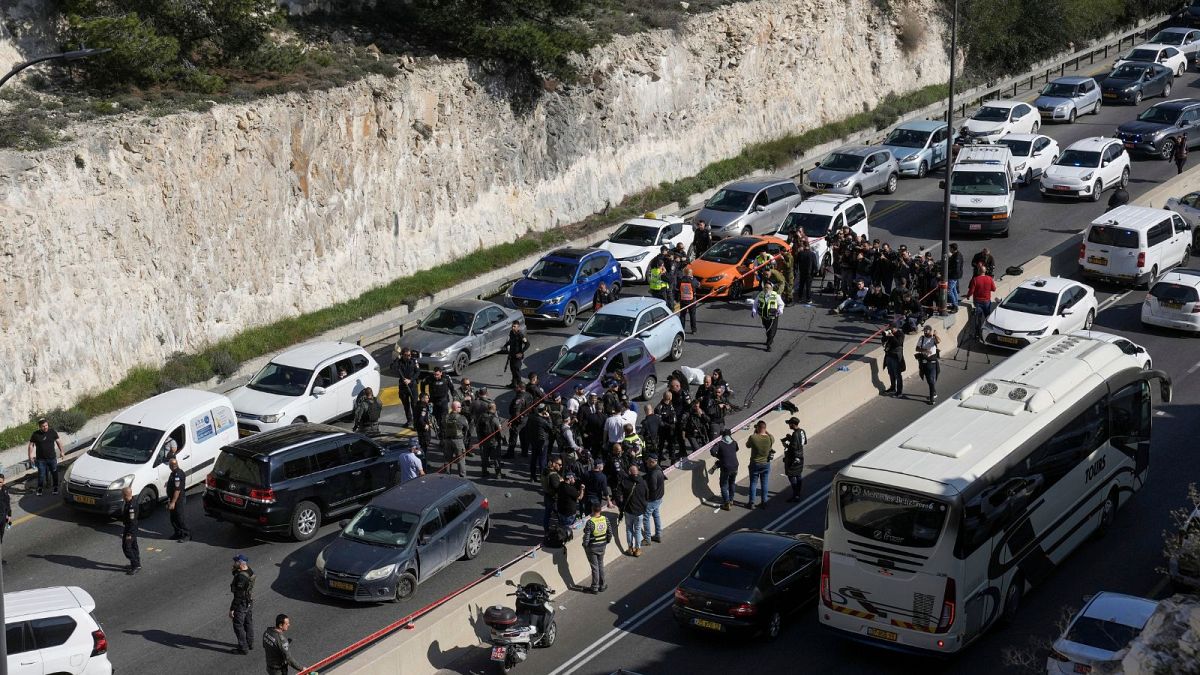 Israeli security forces examine the scene of a shooting attack near the West Bank settlement of Maale Adumim, Thursday, Feb. 22, 2024.