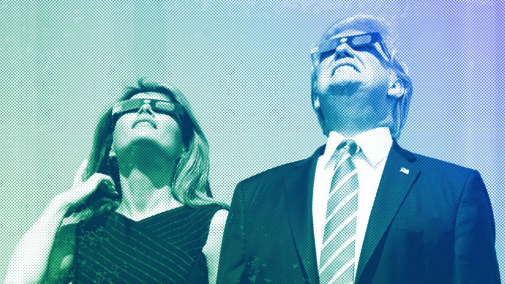 President Donald Trump and first lady Melania Trump wear protective glasses as they view the solar eclipse at the White House in Washington, August 2017