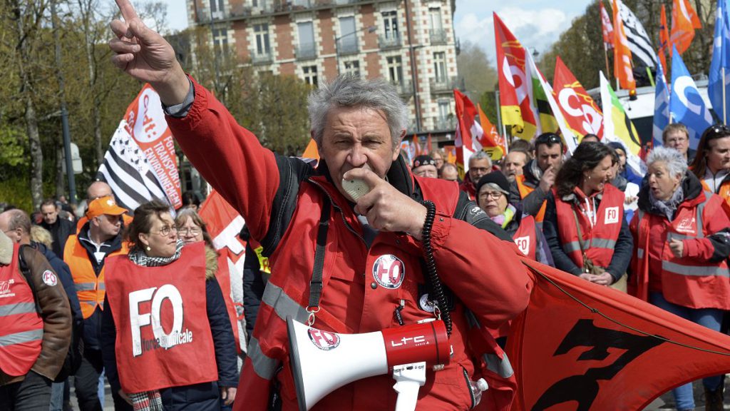 An unionist leads an demonstration against pension reform in Rennes, France. April 13, 2023.