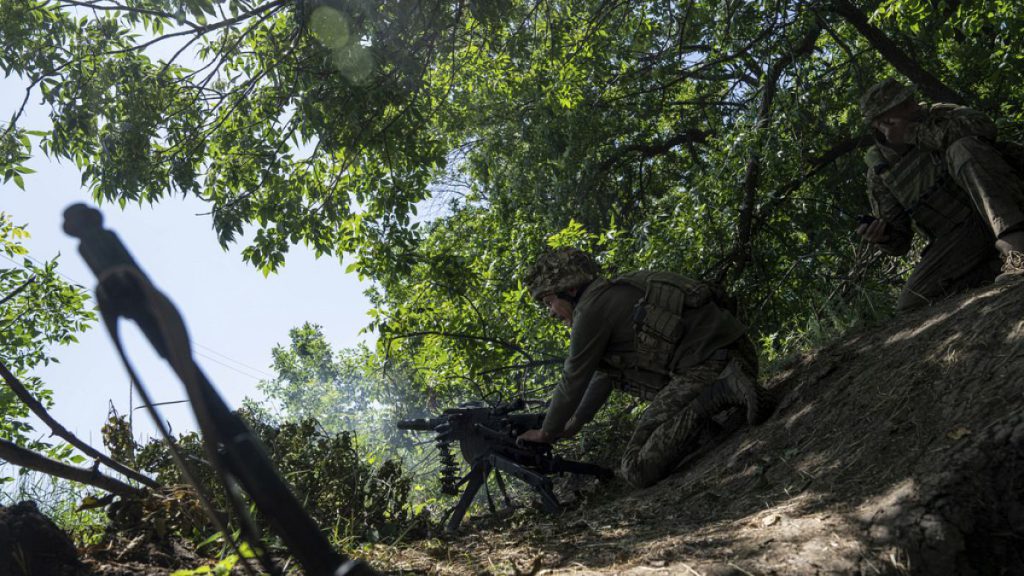 A Ukrainian marine of 35th brigade fires by automatic grenade launcher AGS-17 towards Russian positions on the outskirts of Avdiivka, Ukraine, on June 19, 2023.