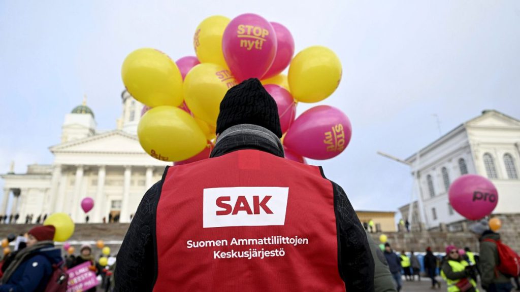 Striking worker takes part in Stop Now! demonstration against govt labour market reforms, Helsinki, 1 February 2024