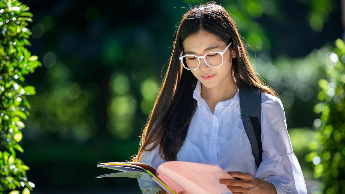 A girl reading a book.