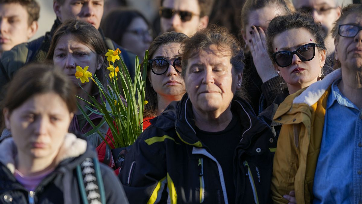 People attend a protest in front of Russian embassy in Belgrade, Serbia, Friday, Feb. 16, 2024.