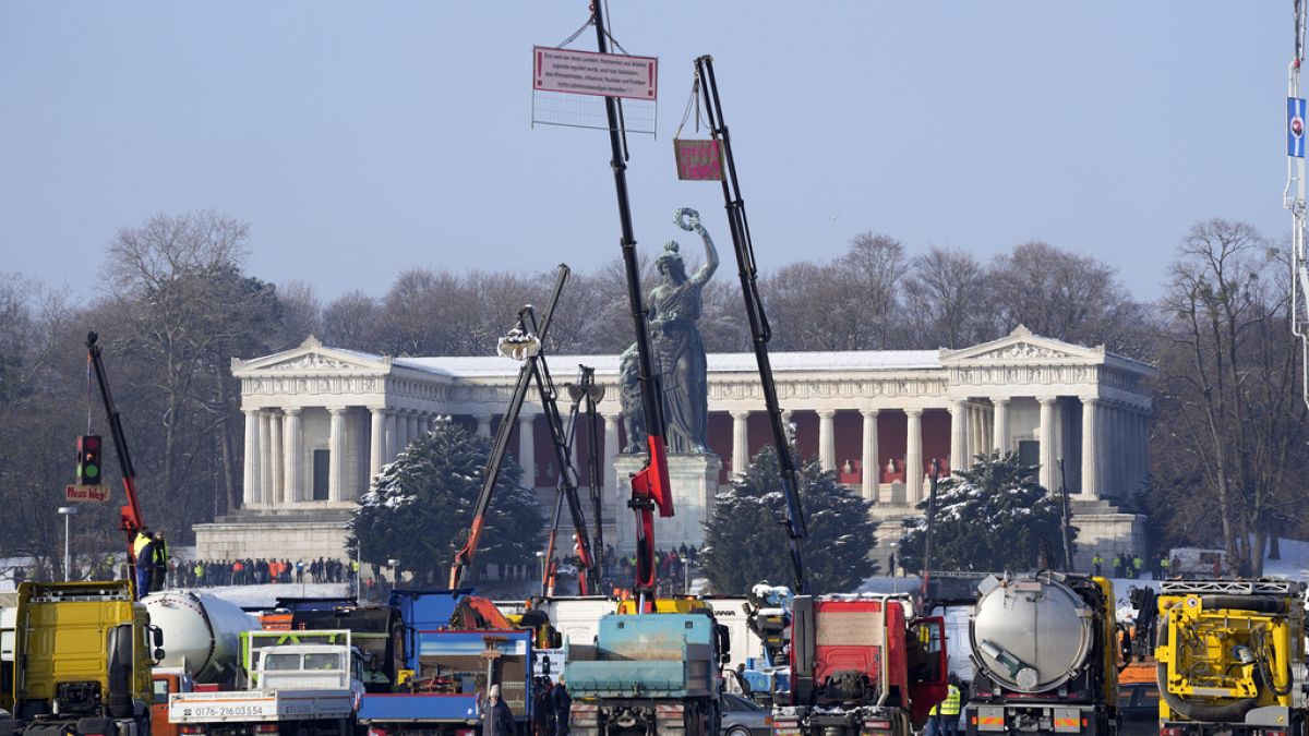 Truck drivers take part in a protest rally against the German government