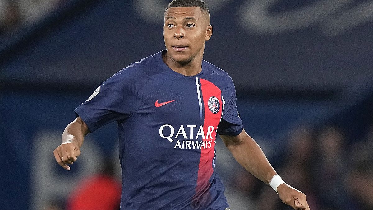 Kylian Mbappe looks on during the French League One soccer match between Paris Saint-Germain and Lens at the Parc des Princes stadium in Paris, Saturday, Aug. 26, 2023.