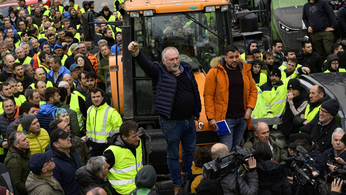 Farmers with their tractors attend a protest in Pamplona, northern Spain, Friday, Feb. 9, 2024. For fourth non stop days, farmers in Spain have staged tractor protests across