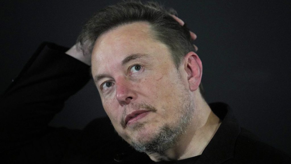 Elon Musk appears at an event with Britain