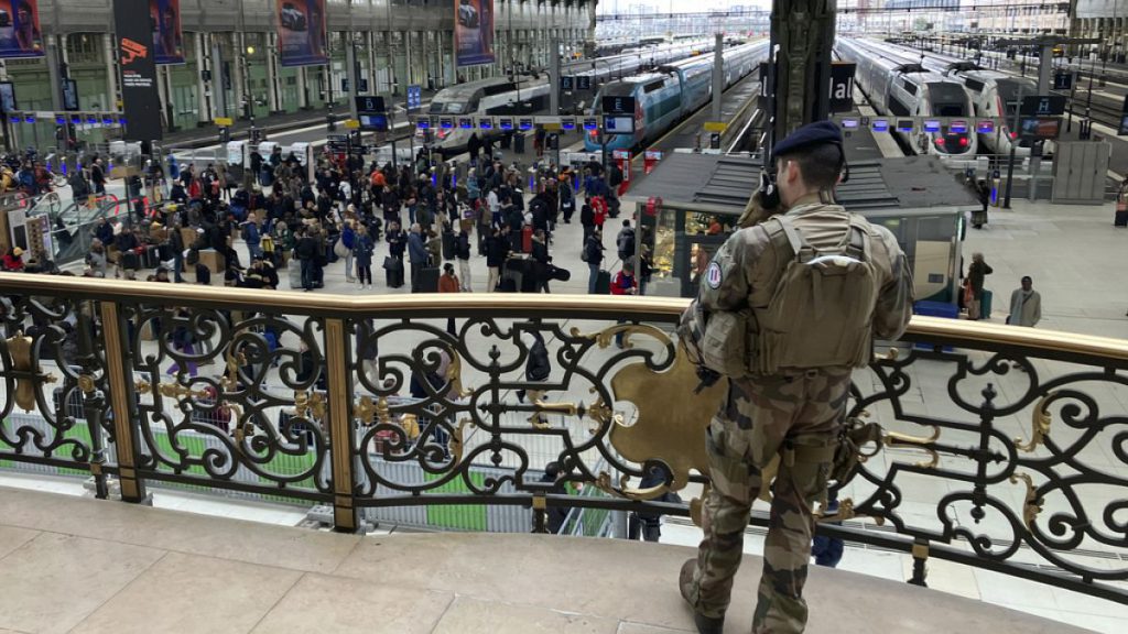 A soldier patrols inside the Gare de Lyon station after an attack, Saturday, Feb. 3, 2024 in Paris.