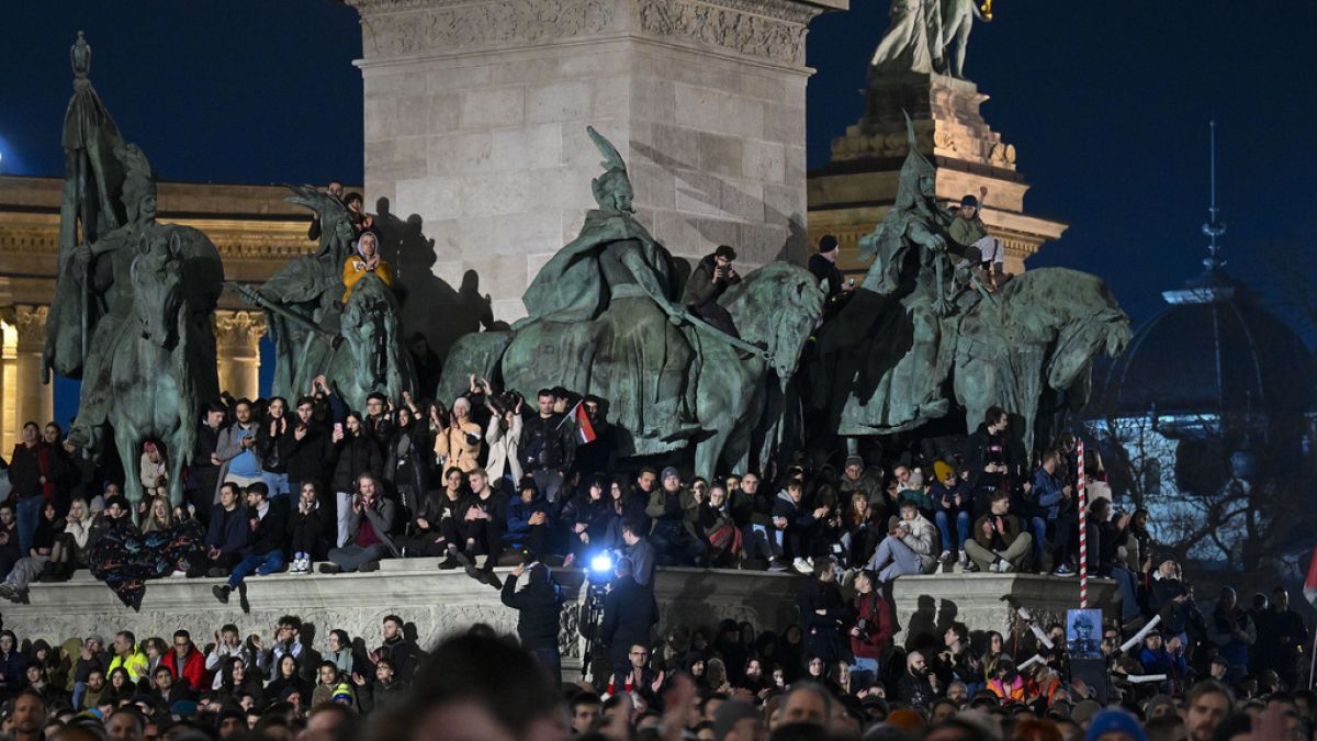 People attend a protest at Heroes