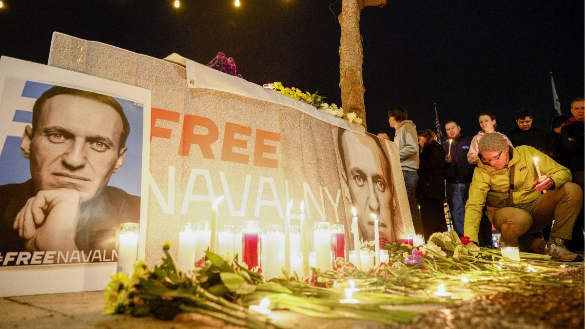 People light candles for a vigil held for Alexei Navalny outside City Hall in San Francisco, Feb. 16, 2024.