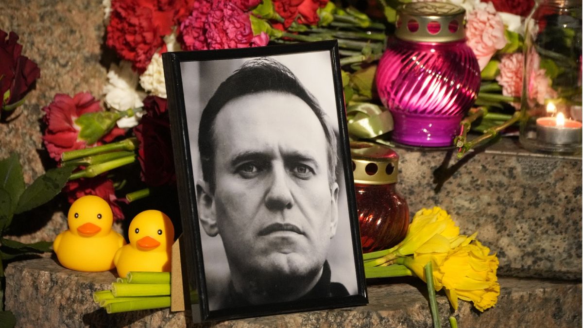 A portrait of Russian opposition leader Alexei Navalny, flowers and candles are laid at the Memorial to Victims of Political Repression in St. Petersburg on Feb 16, 2024.