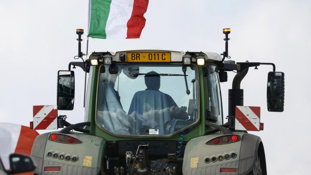 A farmer drives his tractor on the outskirts of Rome, Thursday, Feb. 8 , 2024